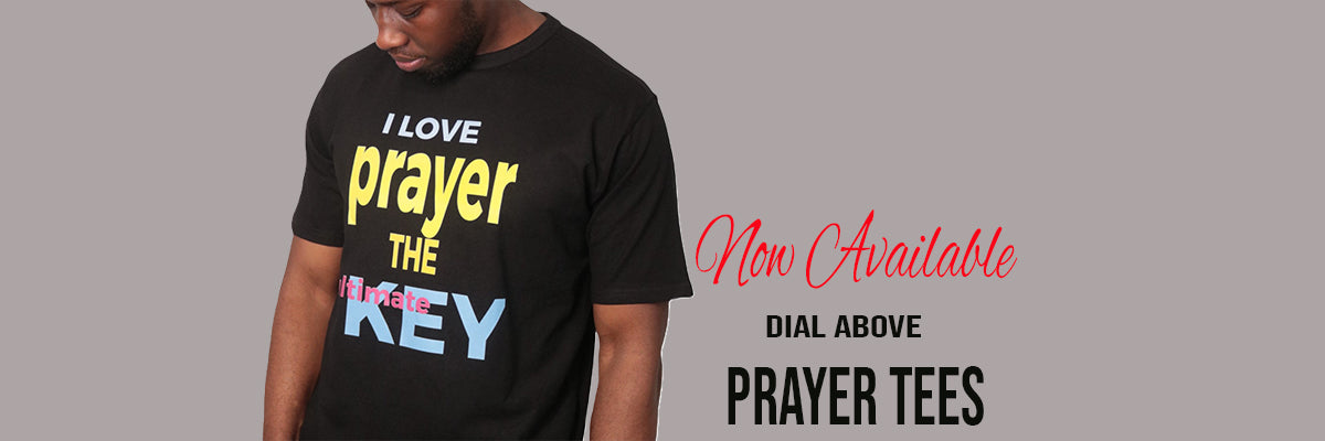 Dial above black t-shirt with bold colorful text, prayer design.